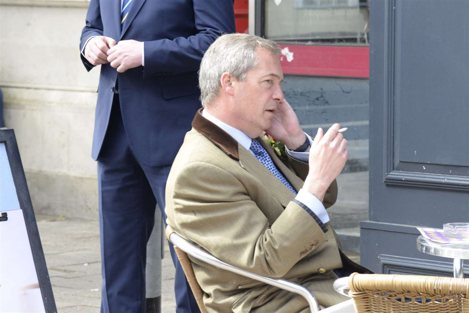 Ukip leader Nigel Farage takes a break to make a call outside Cafe Nero in Ramsgate town centre