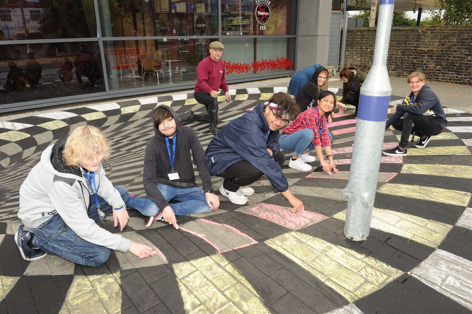 Artists creating a 'Black Hole" outside Rochester Railway Station