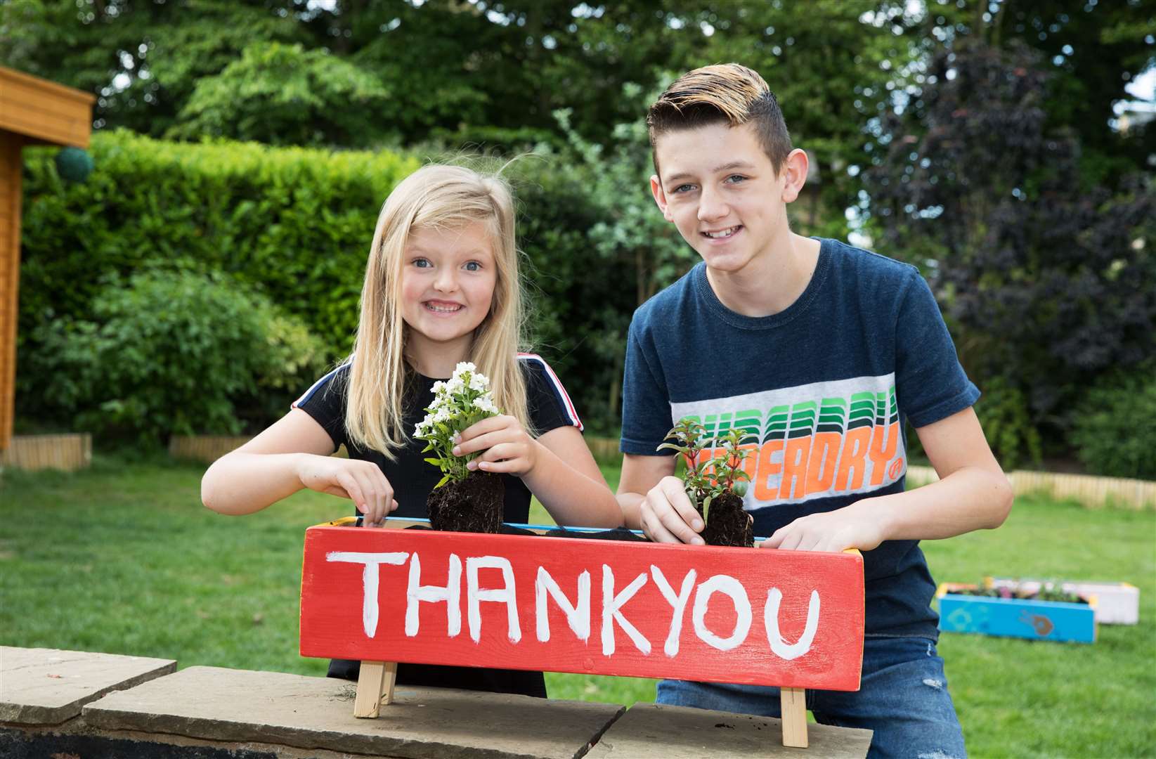 Brooklyn Peart, 12, and his seven-year-old sister Hollie have been painting planters as thank-you gifts for key workers (National Lottery/PA)