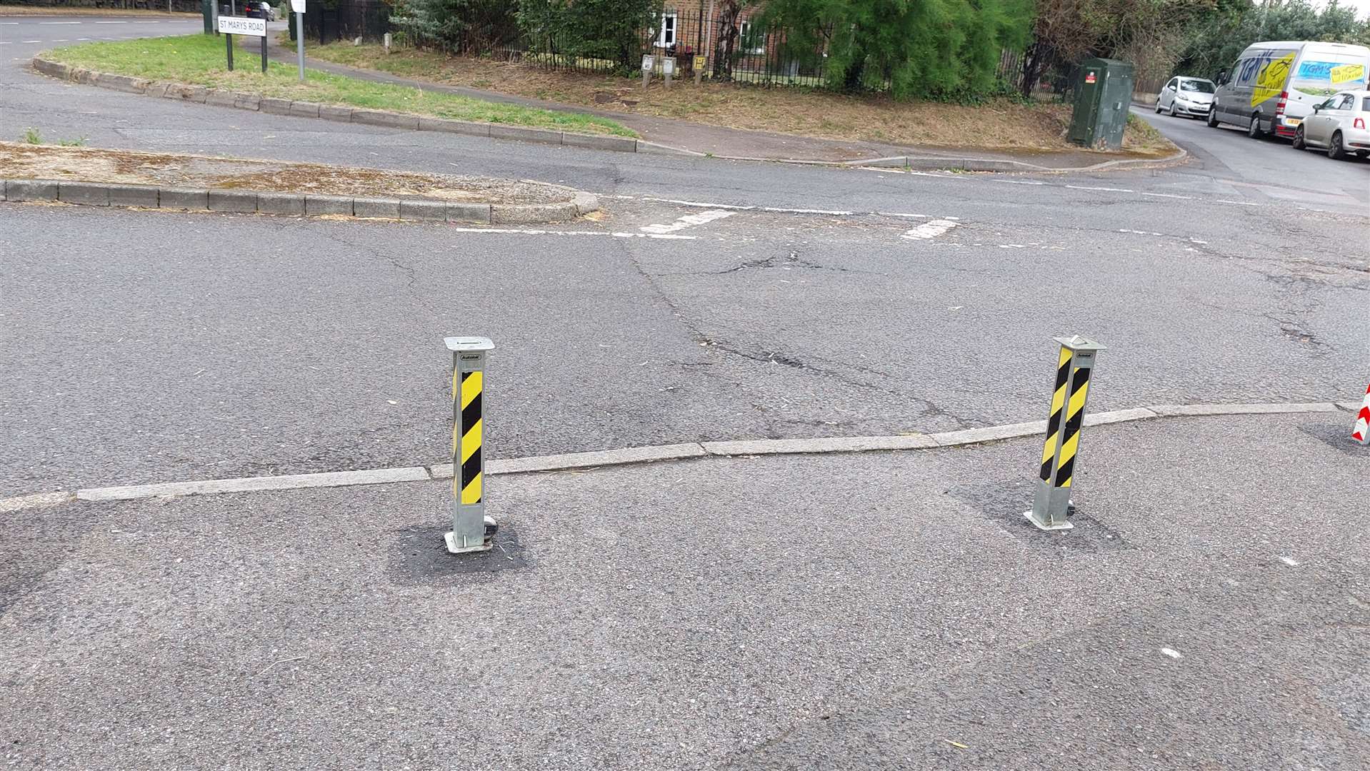 The pub landlord left a break in the middle of the barrier outside The Plough so the public can still walk through