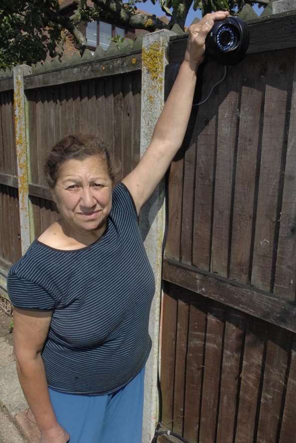 Sheena Ahmet and one of the CCTV cameras in her garden