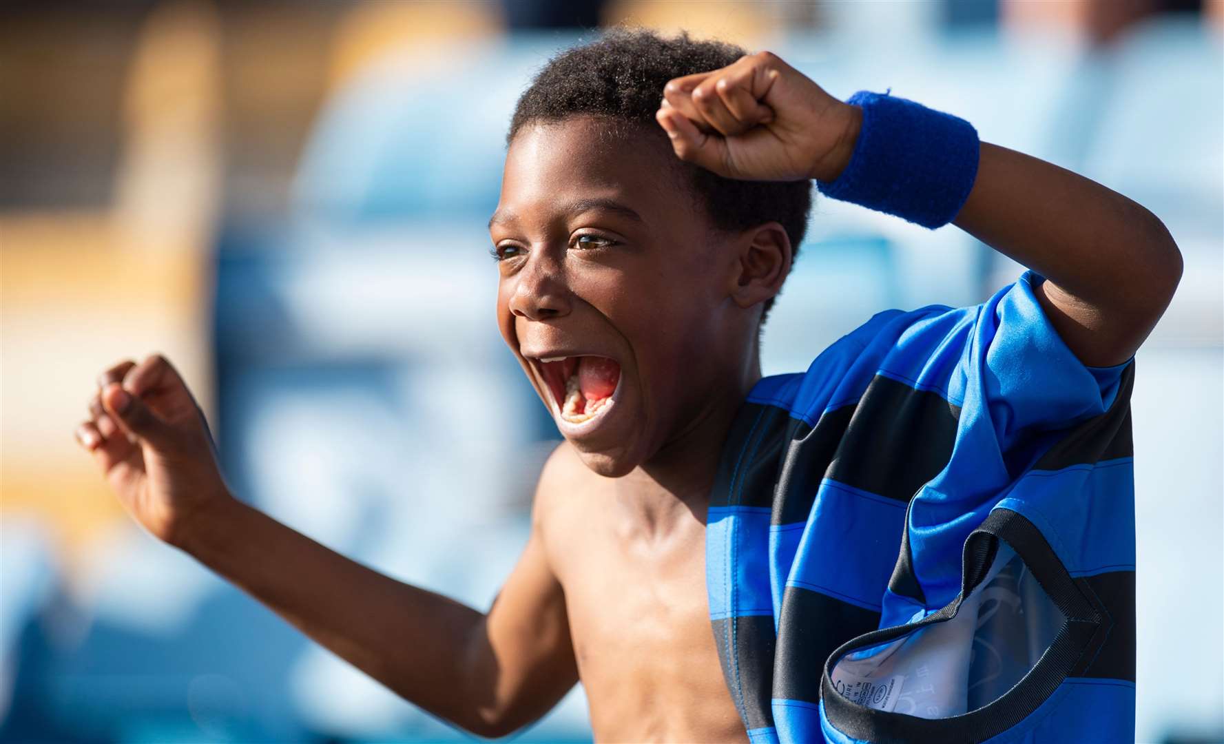 A young Gills fan celebrates at Priestfield last season