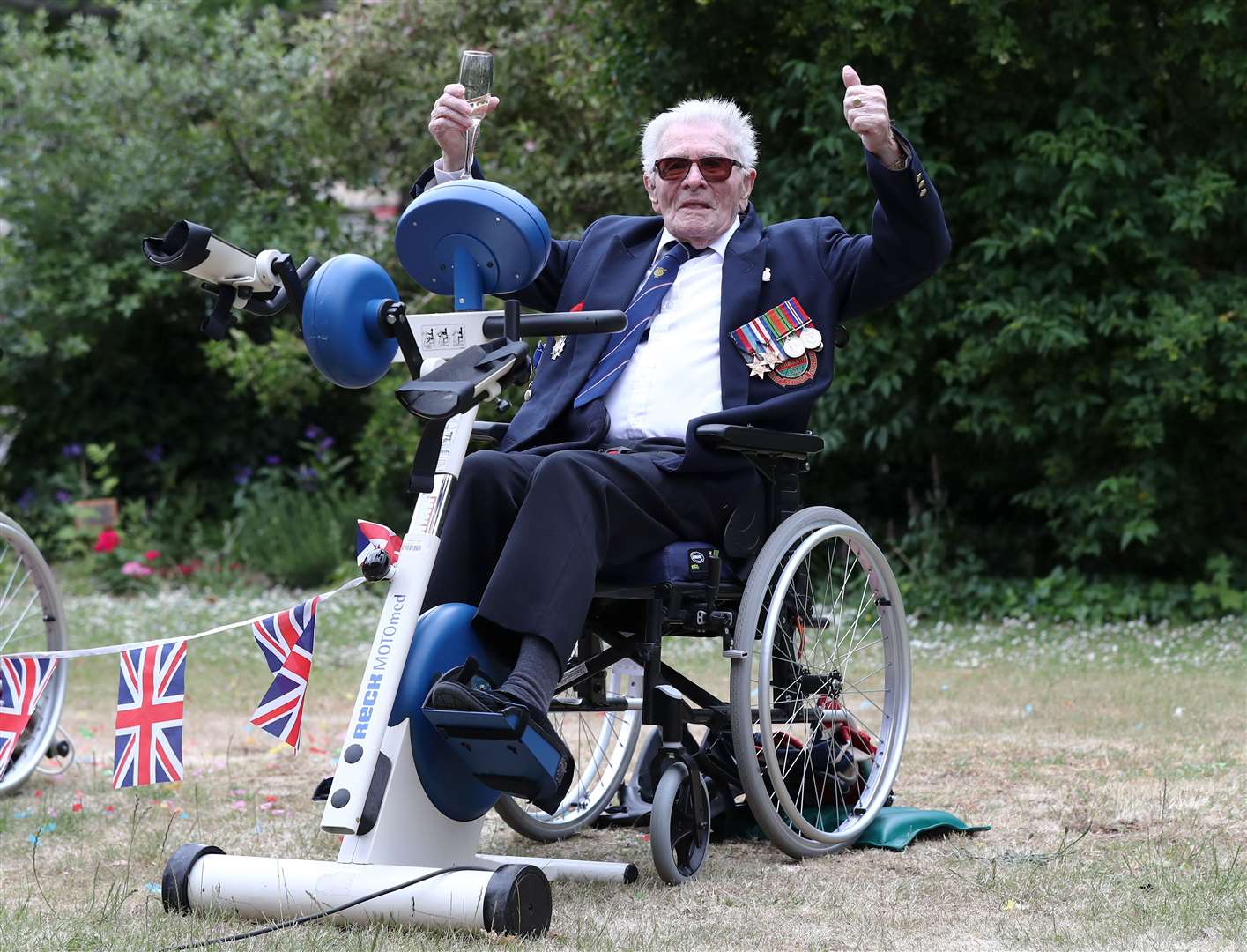 Len Gibbon celebrates as he finishes the challenge (Gareth Fuller/PA)