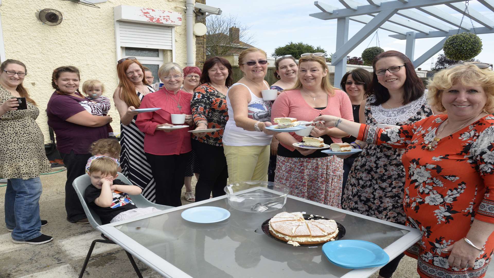 Keeley Nash, right (in the orange) with members of the group