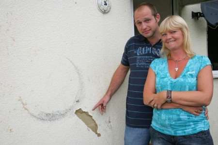 Berron and Sophia Donovan outside their house.