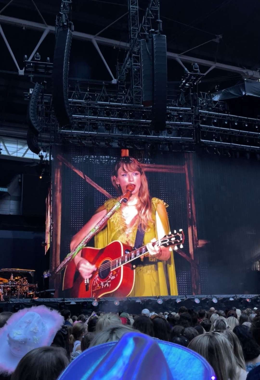 Taylor Swift performs on stage, as seen on a big screen, during her Eras Tour concert at Wembley Stadium (Natasha Leake/PA)