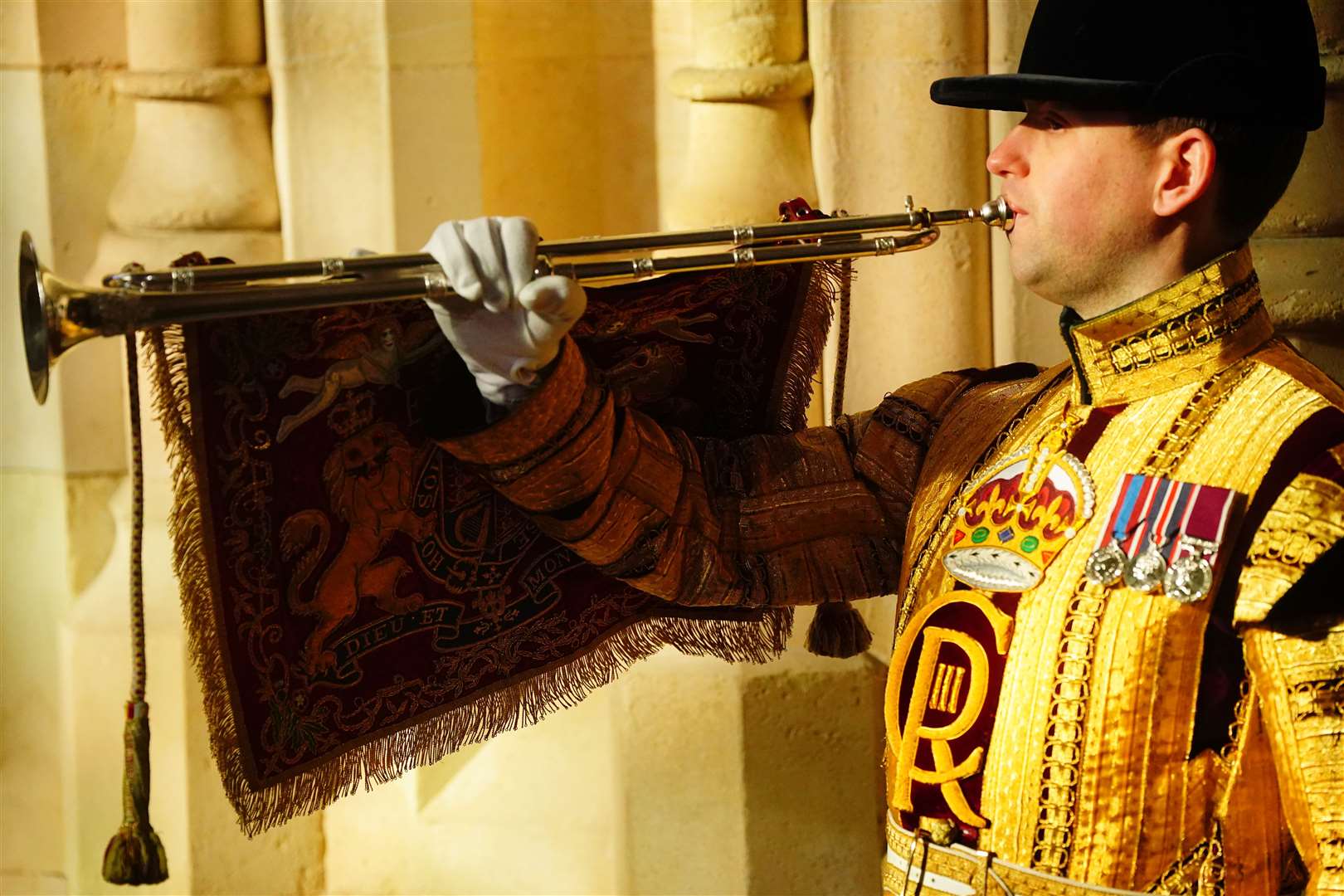 A state trumpeter at the Sovereign’s Entrance to the Palace of Westminster ahead of the ceremony (Victoria Jones/PA)