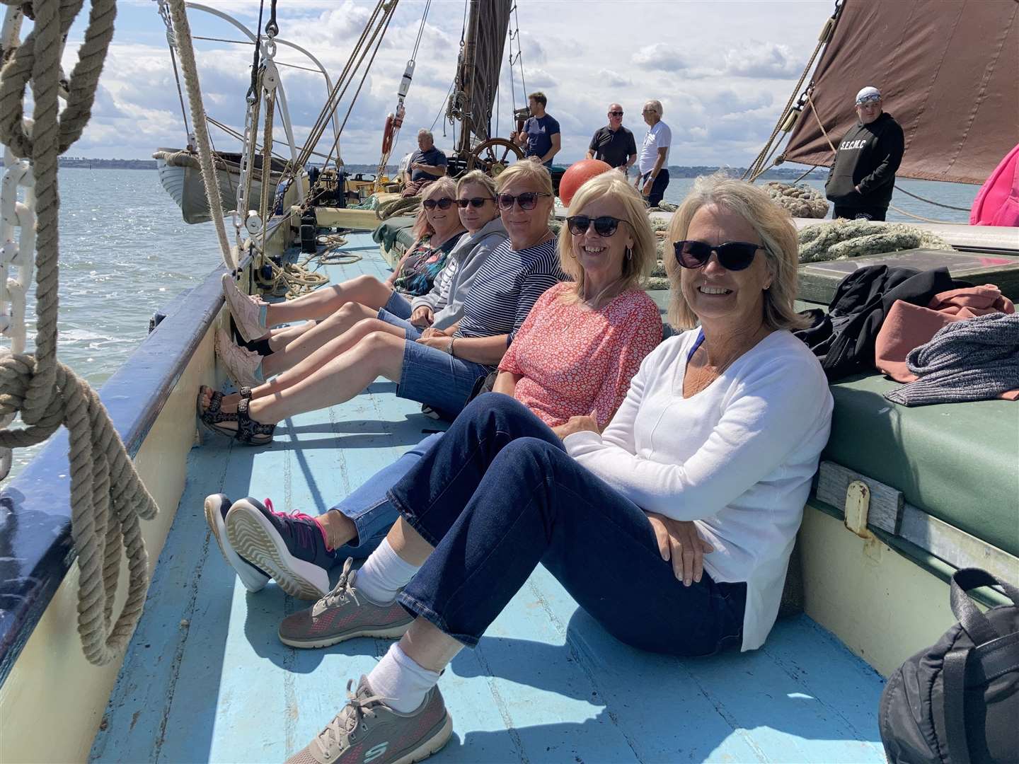 Lapping up the sun on the deck of Thames sailing barge the Edith May
