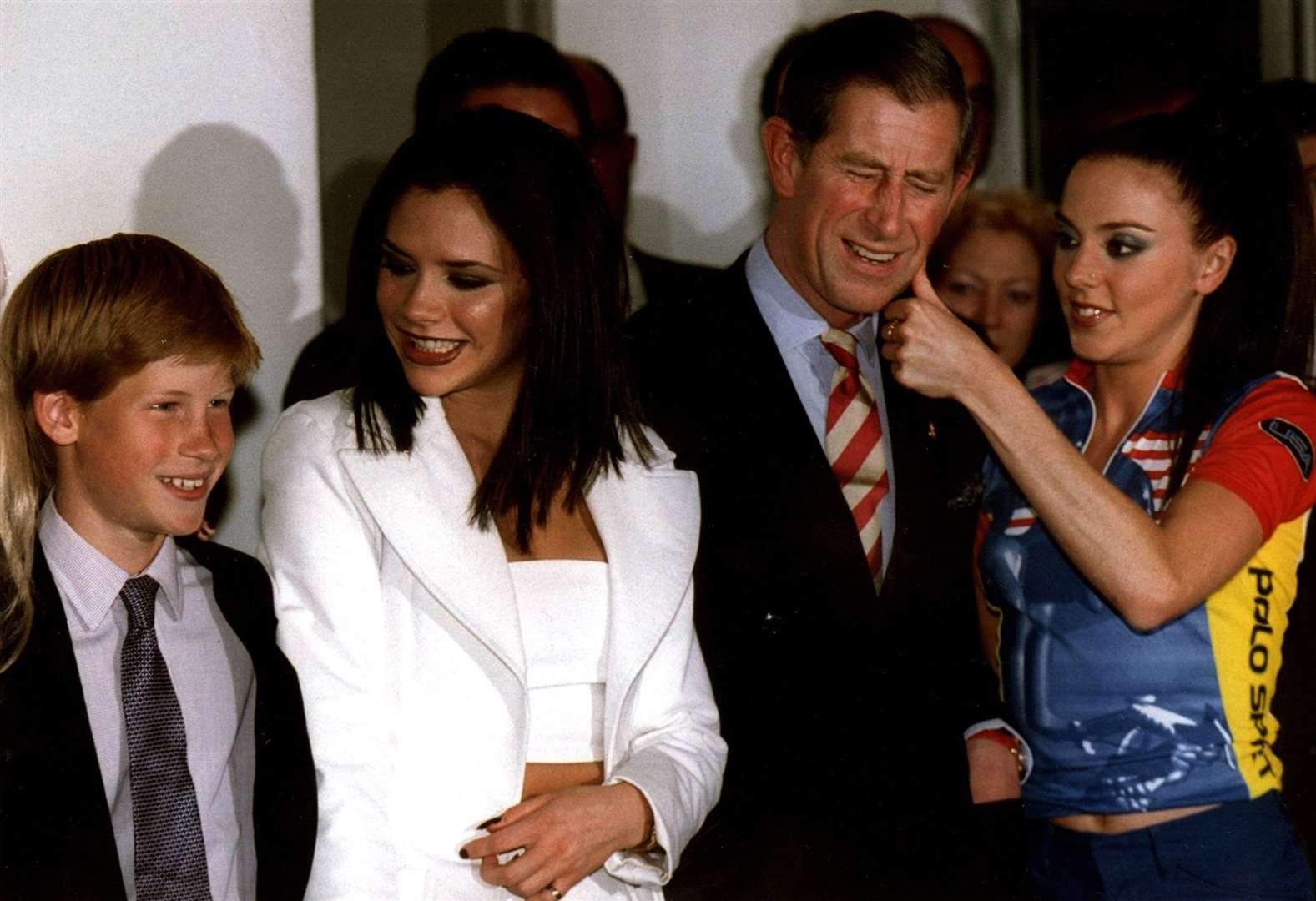 Prince Harry poses with ‘Posh Spice’ and the then-Prince of Wales before the Spice Girl’s concert in Johannesburg (PA)