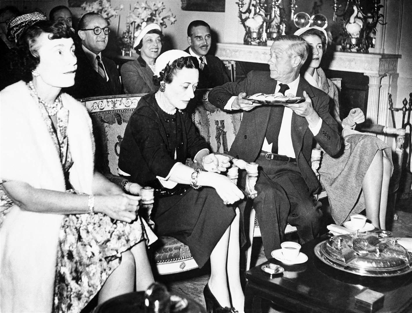 The duke passing a plate of food at the screening (PA)