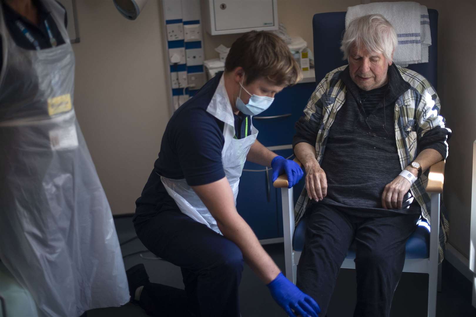 Rehab Support workers perform a physiotherapy treatment on patient Michael Kidd, 82 (Victoria Jones/PA)