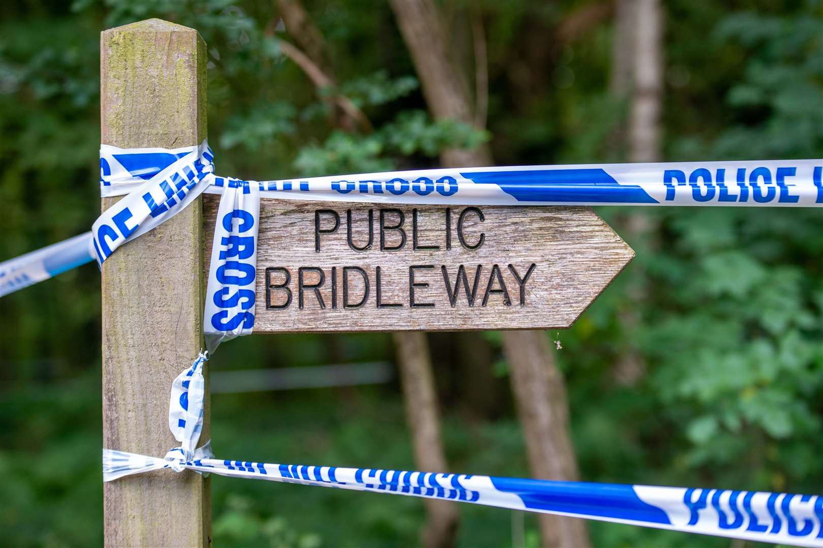 Officers search the land at Sand Hutton Gravel Pits near York (Mark Brickerdike/PA)