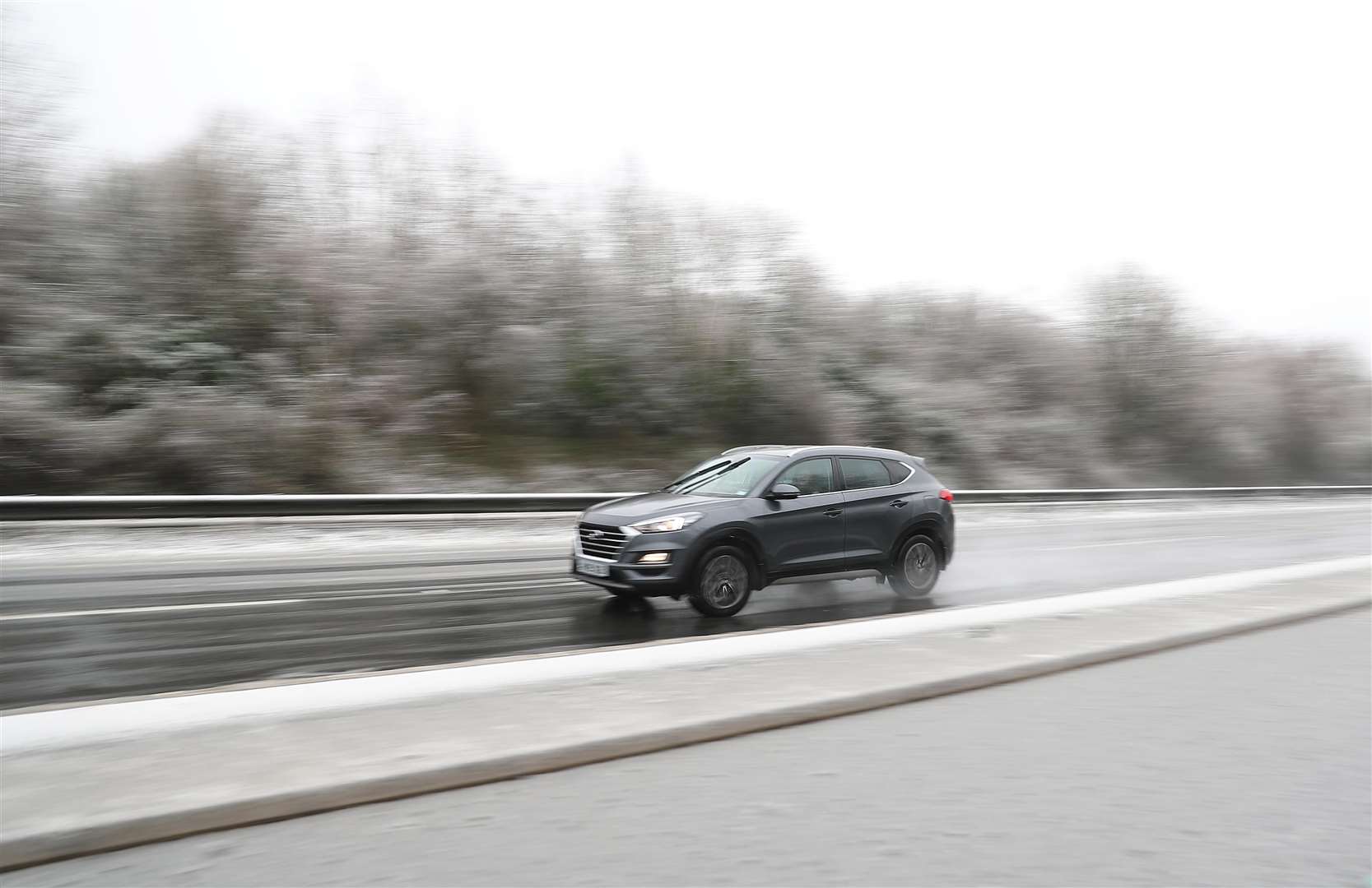 A car in snowy conditions on the A303 near Andover (Andrew Matthews/PA)