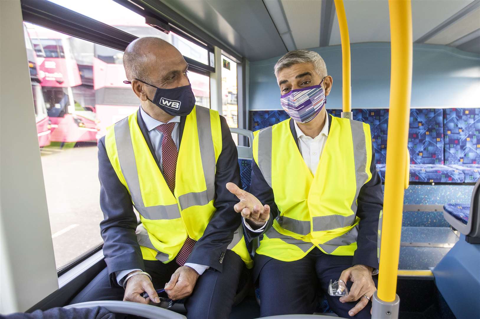 Sadiq Khan, right, speaking with Buta Atwal, CEO of Wrightbus (Liam McBurney/PA)