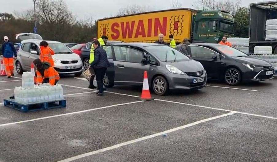 Cars being stocked with bottled water at Tesco in Pembury Road, Tunbridge Wells