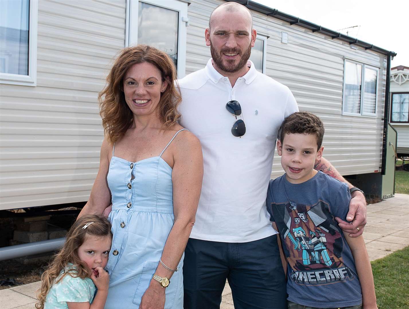 Rosie, Emma, Dean and Euan Giles outside the caravan