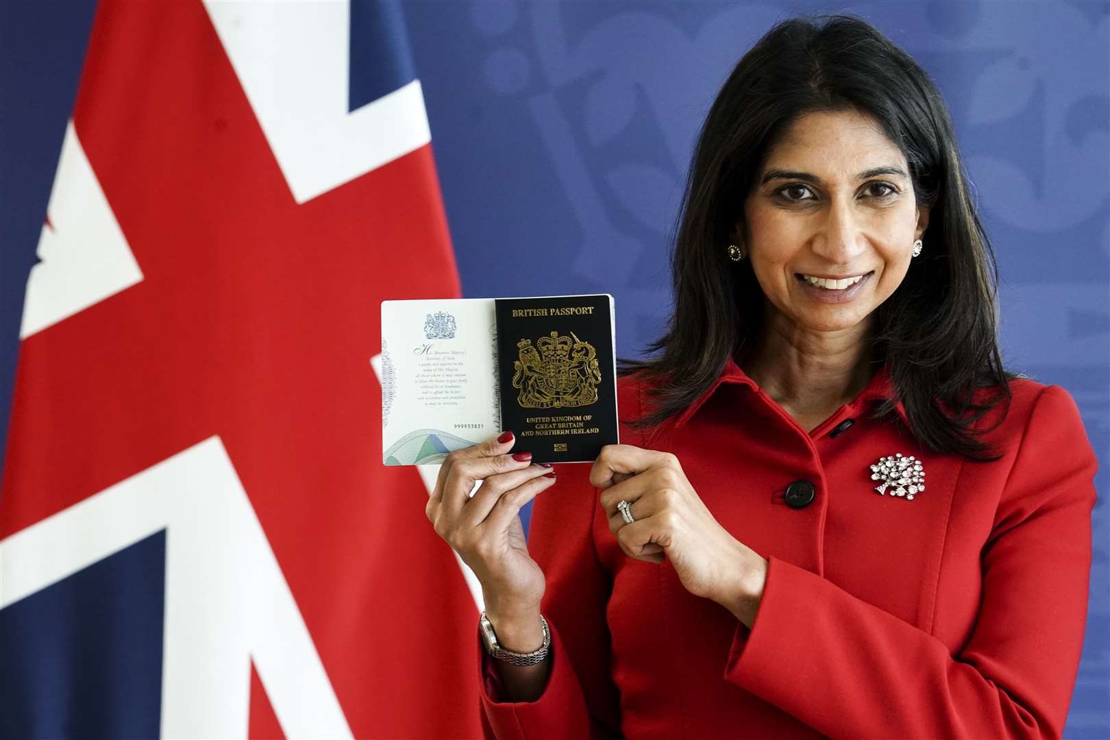 Home Secretary Suella Braverman with the new passport (Jordan Pettitt/PA)