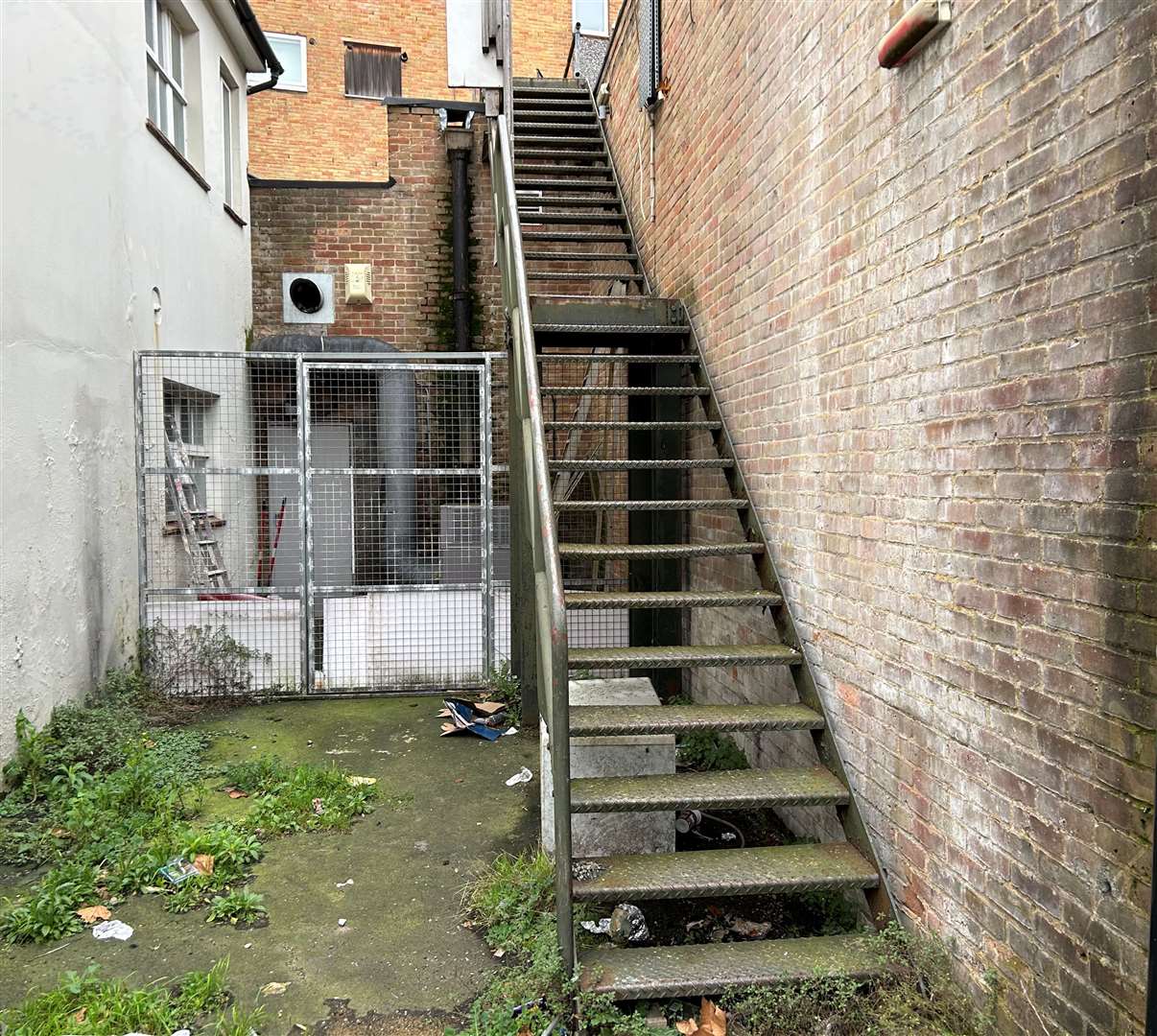 The steps at the back of the building leading from the bins to Paramount House