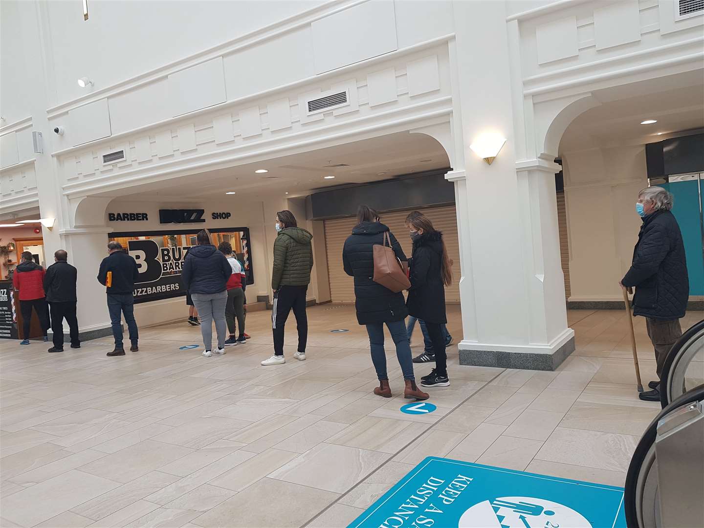 People queue for a haircut at Buzz Barbers in Tunbridge Wells