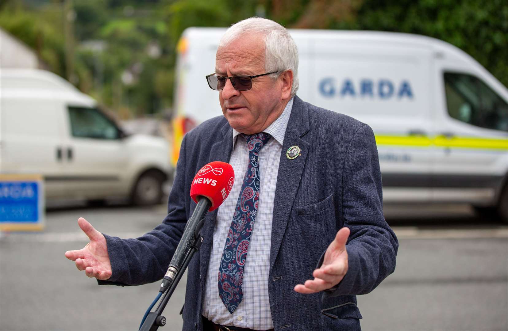 Local TD Mattie McGrath speaking to media the scene of the crash (Damien Storan/PA)