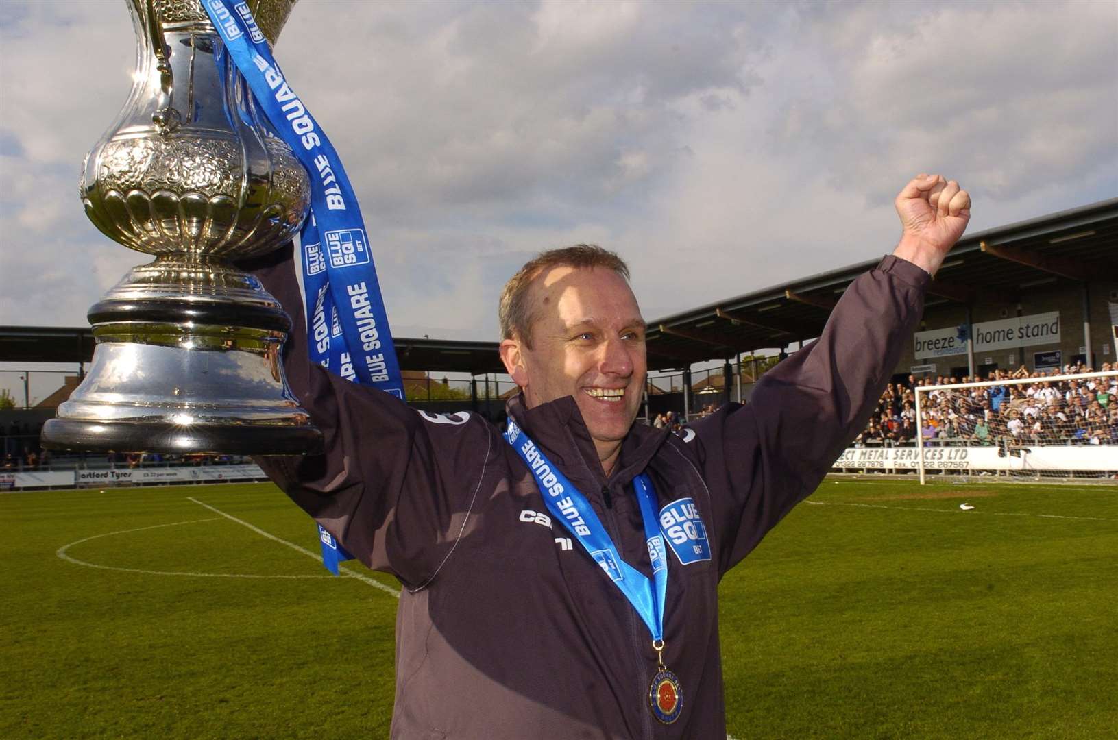 Tony Burman celebrates promotion to the Conference in 2012 Picture: Steve Crispe