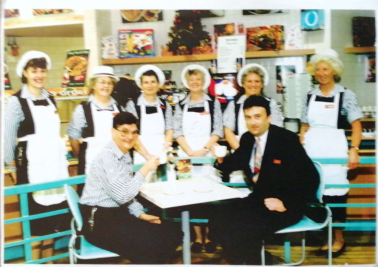 Ros Farley (standing second on the left) with old Woolworths colleauges, her family hope they may be able to help