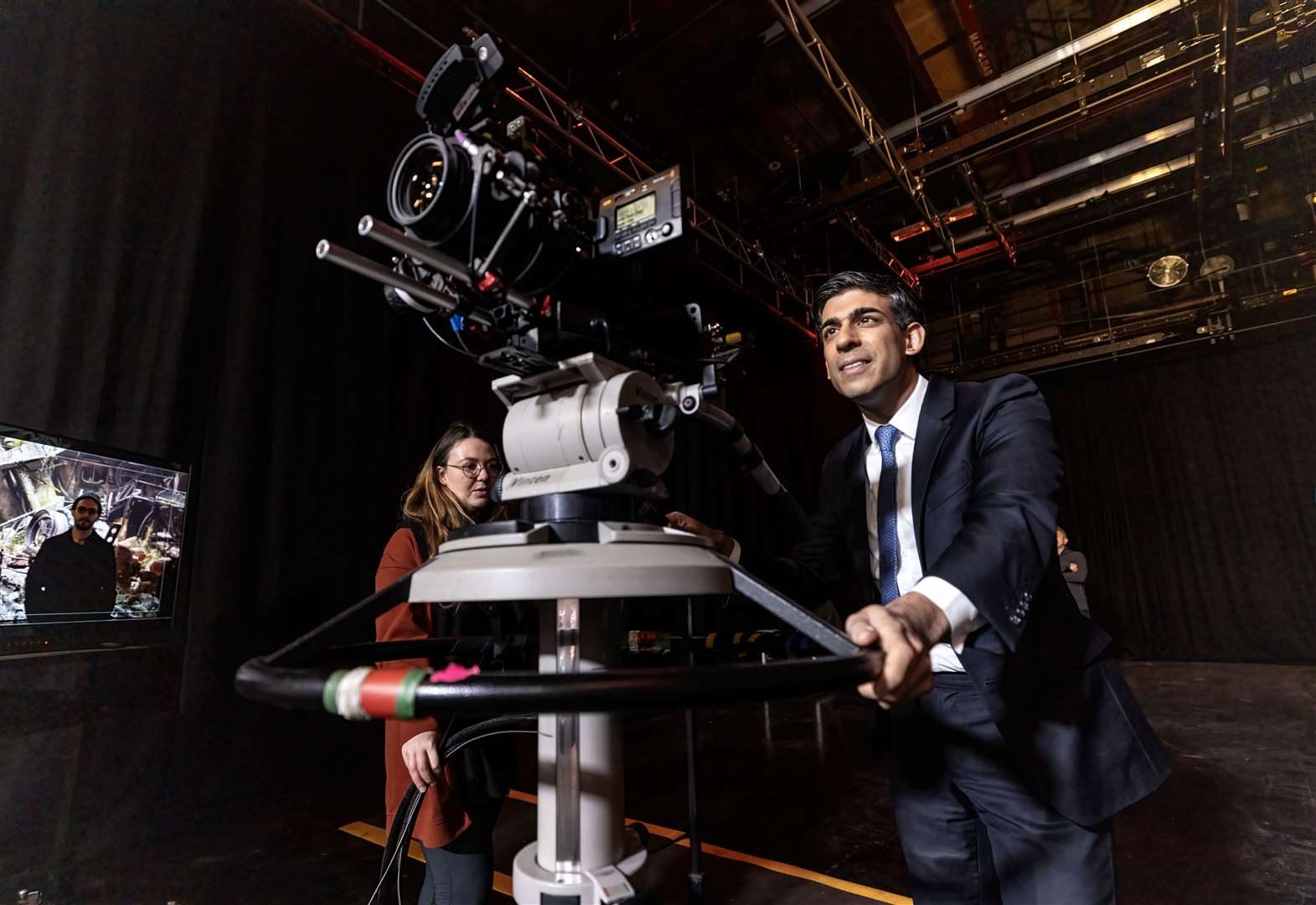 Mr Sunak operates a TV studio floor camera (Richard Pohle/The Times/PA)