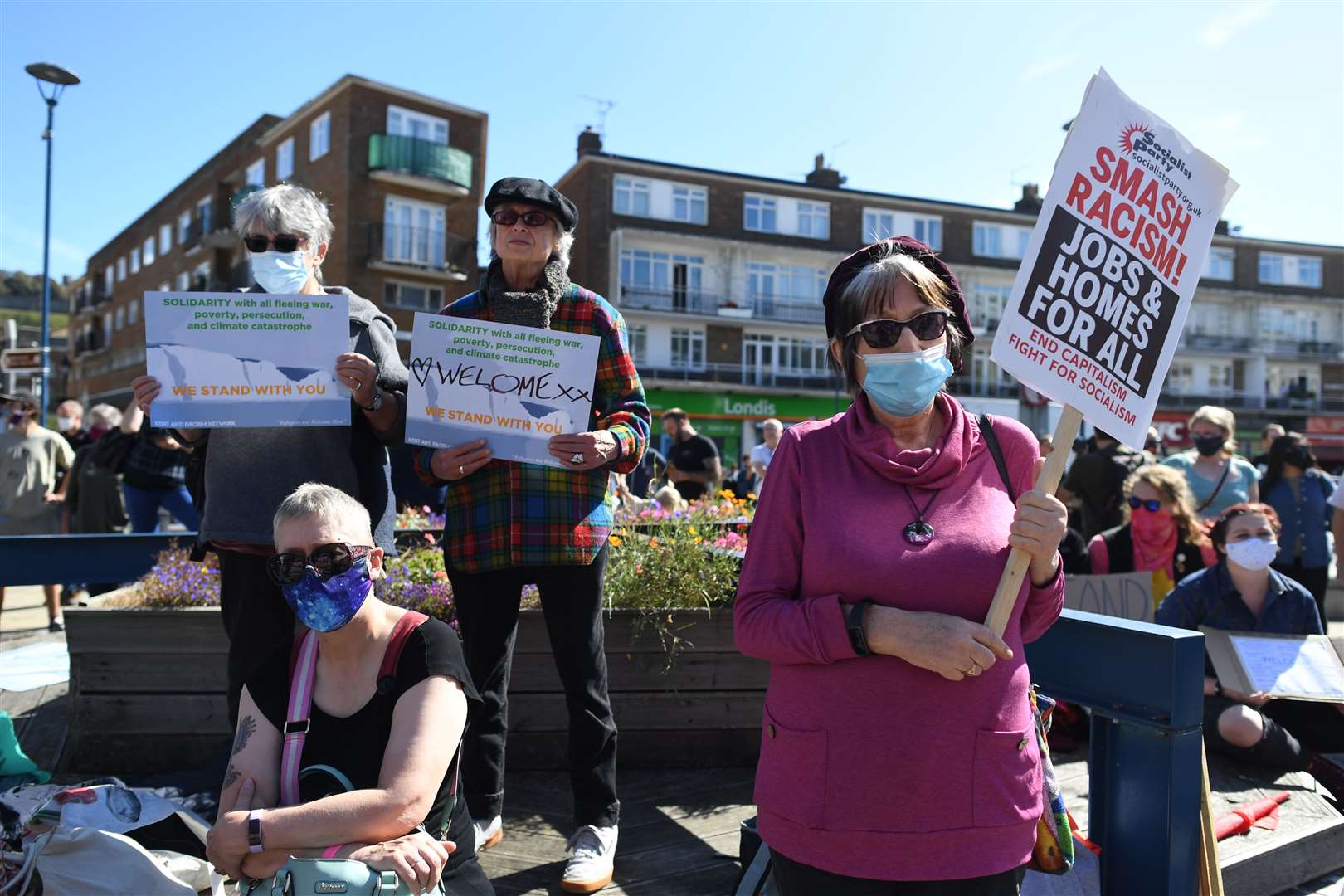 Pro-migrant supporters during a ‘solidarity stand’ in the Market Square, Dover (Stefan Rousseau/PA)