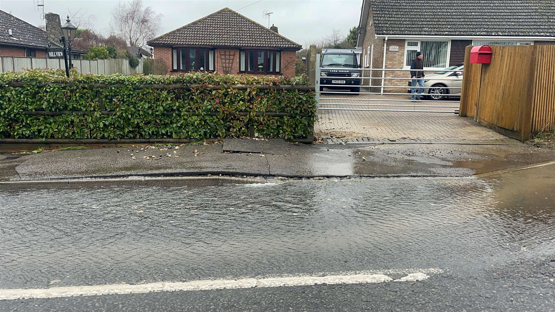 Water is flowing along Kingsnorth Road in Ashford