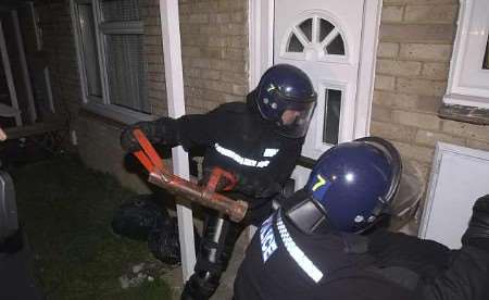 EARLY MORNING CALL: Police officers launch Operation Commando. Picture: PAUL DENNIS