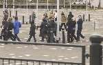 Shoppers and passers-by heading away from the site before the true picture emerged. Photograph: BARRY CRAYFORD