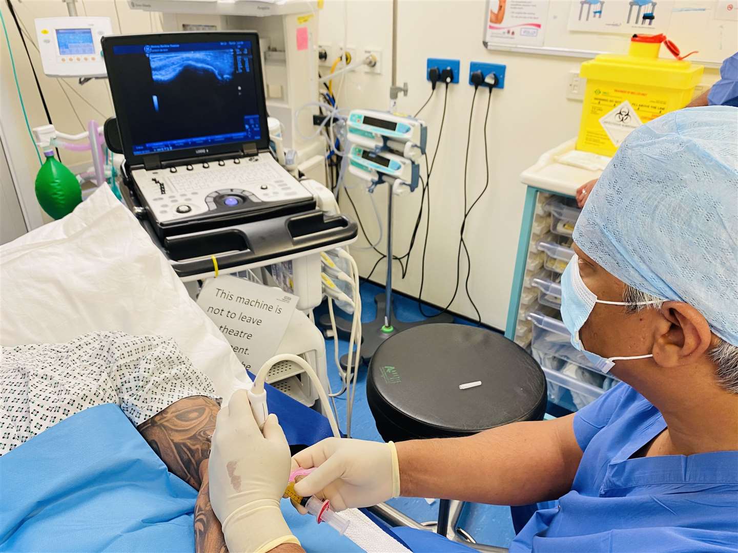 Professor Bijay Singh applies the new ‘blood spinning’ treatment to a patient (48465522)