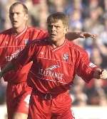 TWO MEN WITH ONE AIM: Captain Paul Smith, left, and player-manager Andy Hessenthaler in action against Pompey on Saturday. Picture: GRANT FALVEY