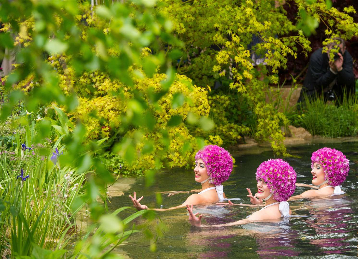 Synchronised swimmers perform in a pond in 2015 (Dominic Lipinski/PA)