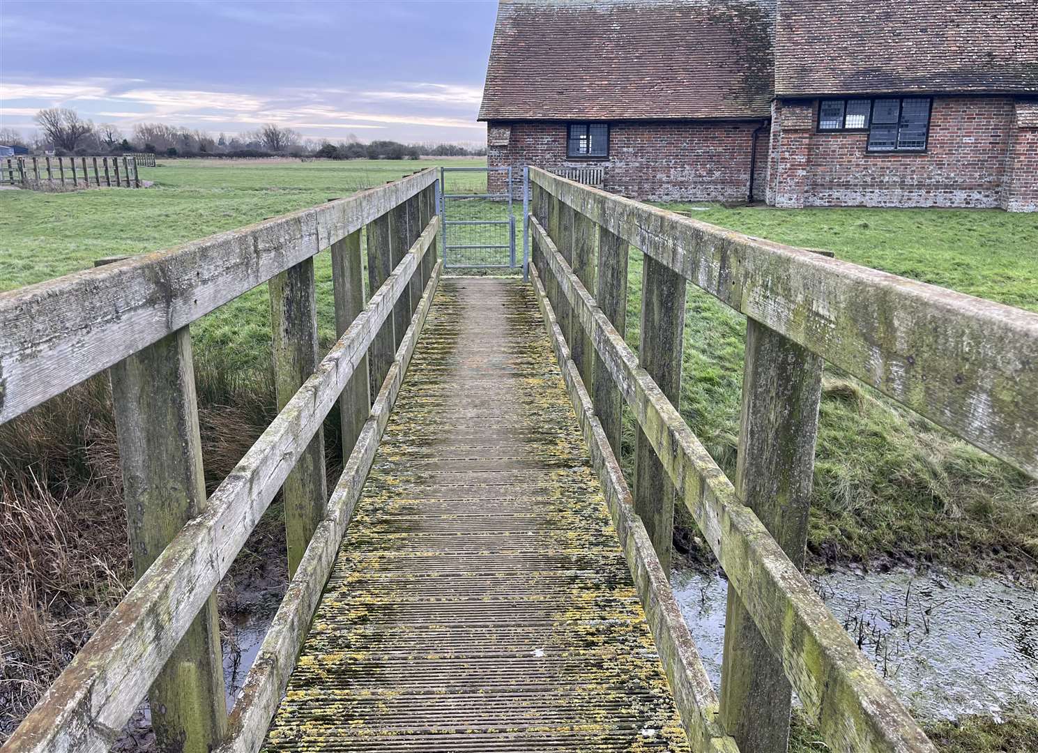 The only way to access St Thomas Becket Church in Romney Marsh is by crossing a bridge