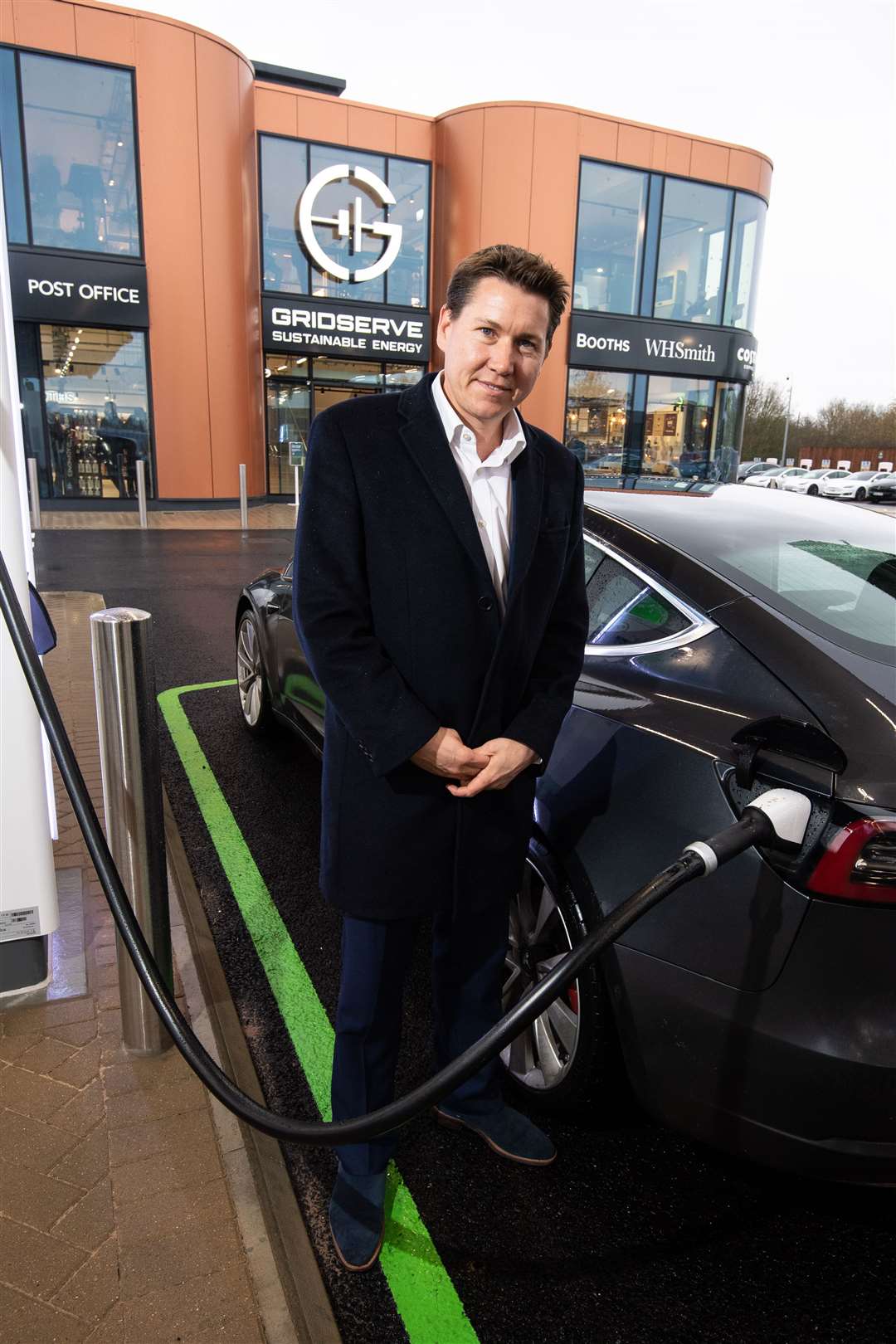 Toddington Harper charging a Tesla (Gridserve/PA)