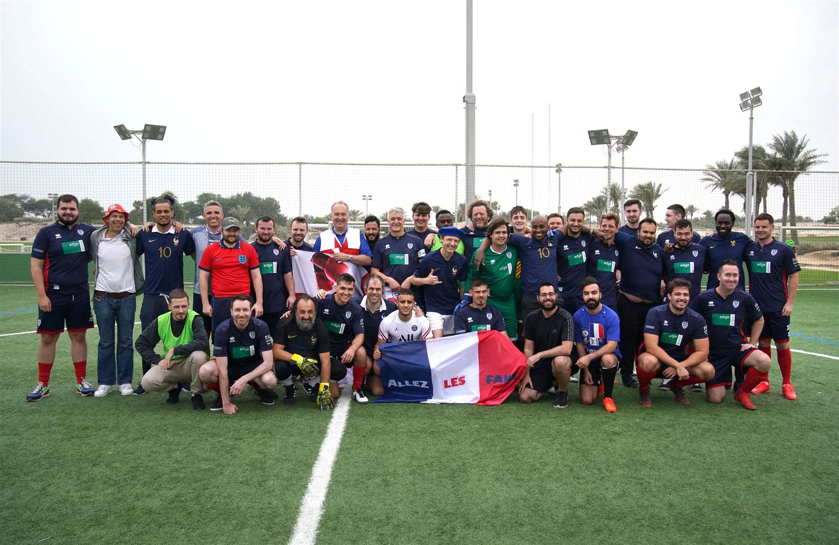 England and French supporters before their seven-a-side game in Doha (Peter Byrne/PA)