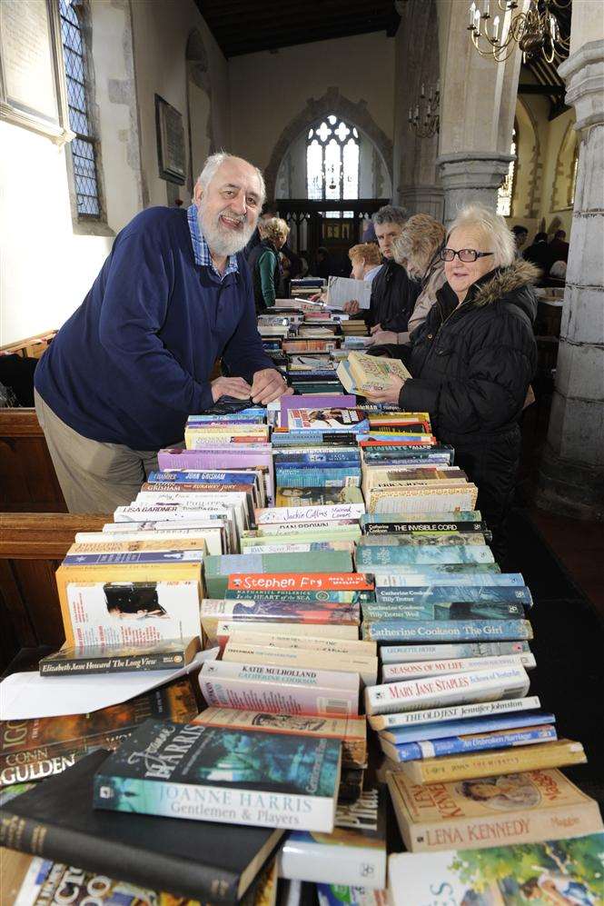 Book seller Steven Emms and Madeline Ashford at the Trash and Treasure sale at St Nicholas At Wade Church.