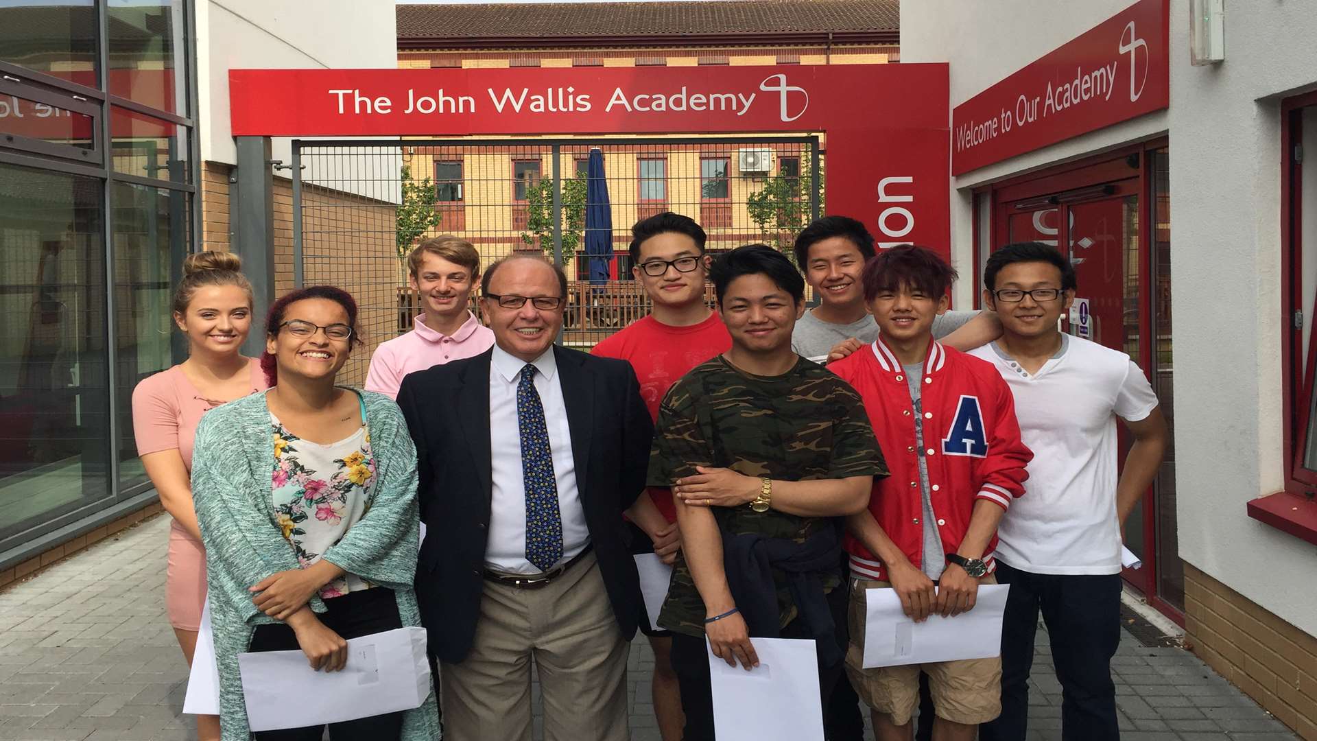 John Wallis Academy pupils celebrate their results with head Mr John McParland