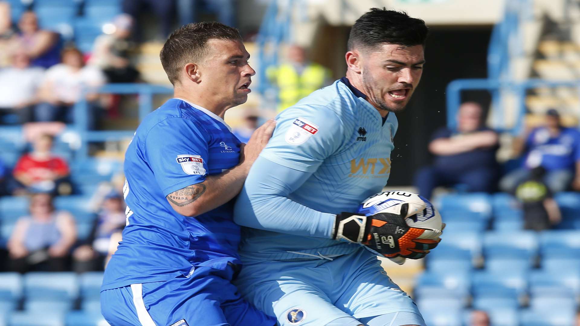 Cody McDonald challenges the Millwall keeper Picture: Andy Jones