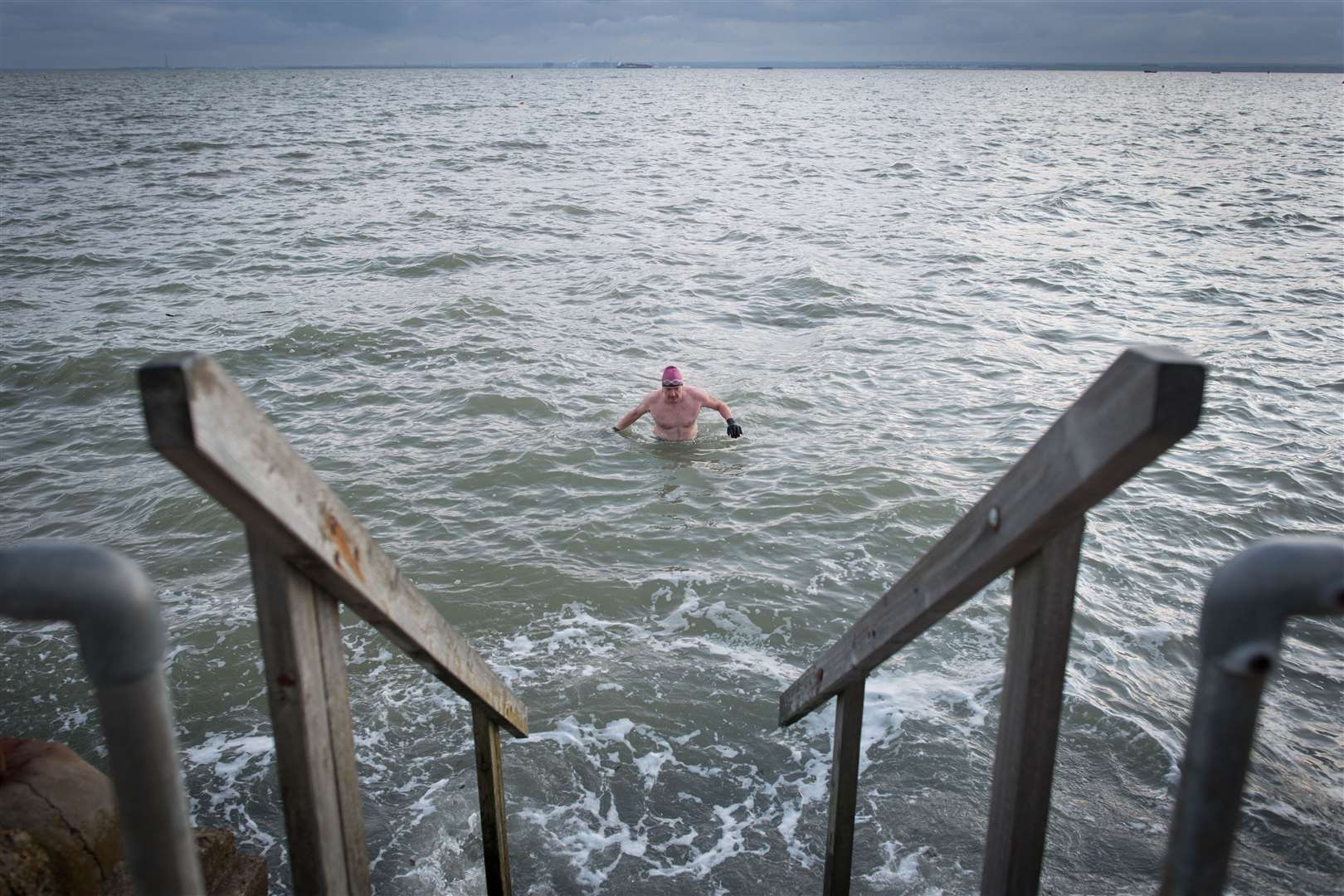 A swimmer braves the cold in the Thames estuary at Leigh-on Sea in Essex (Stefan Rousseau/PA)