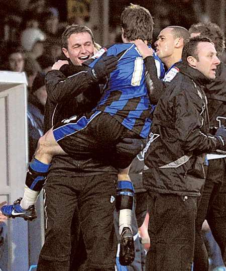 Luke Rooney celebrates his equaliser with assistant manager Ian Hendon