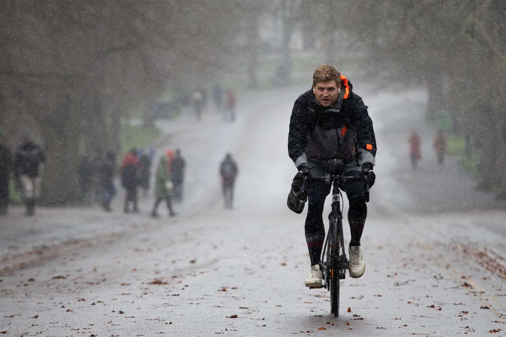 Cycling through Greenwich Park in London (Aaron Chown/PA)