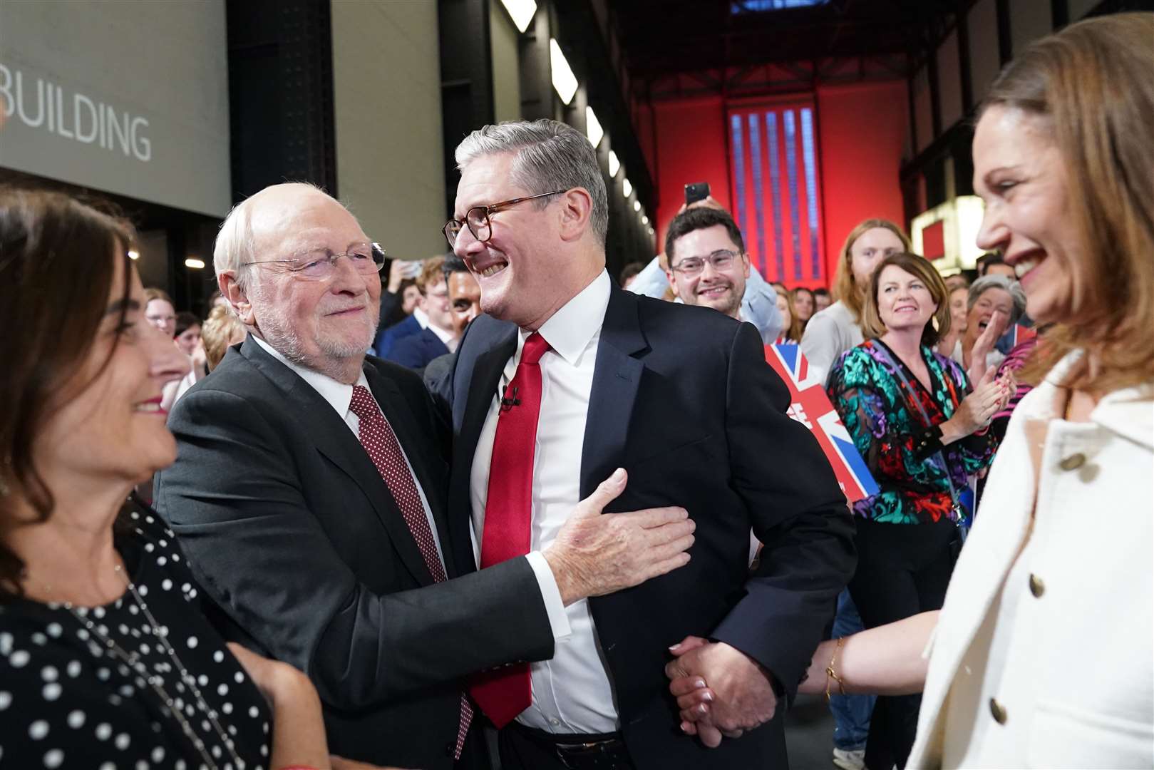 Labour leader Sir Keir Starmer and his wife Victoria are greeted by Neil Kinnock at the Tate Modern after securing victory (Stefan Rousseau/PA)