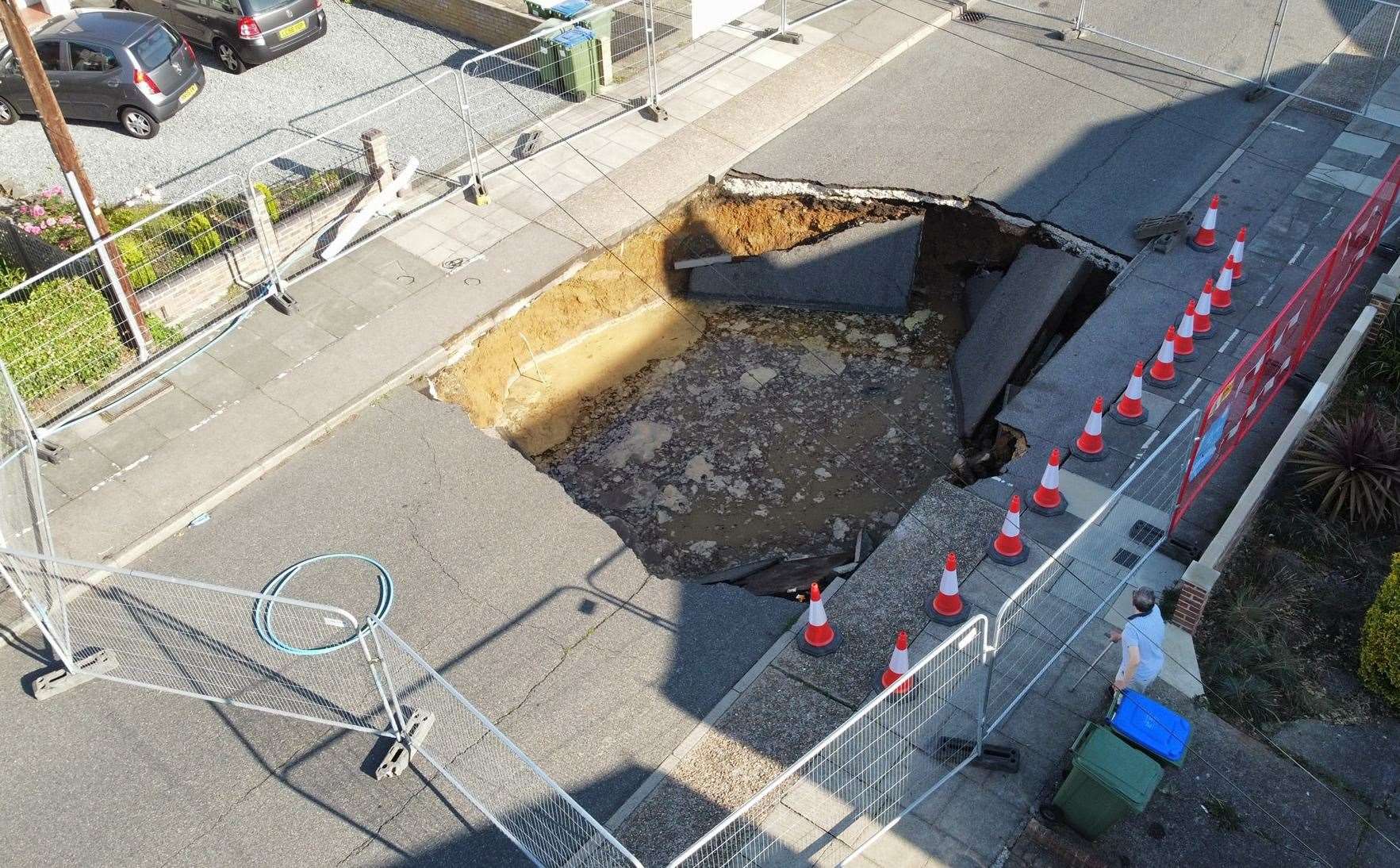 A cordon has been put in place around the huge sinkhole which opened up in the middle of Martens Avenue, Bexleyheath last week. Photo: Mike Stevens