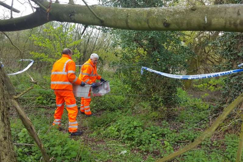 Serco workers clearing the site