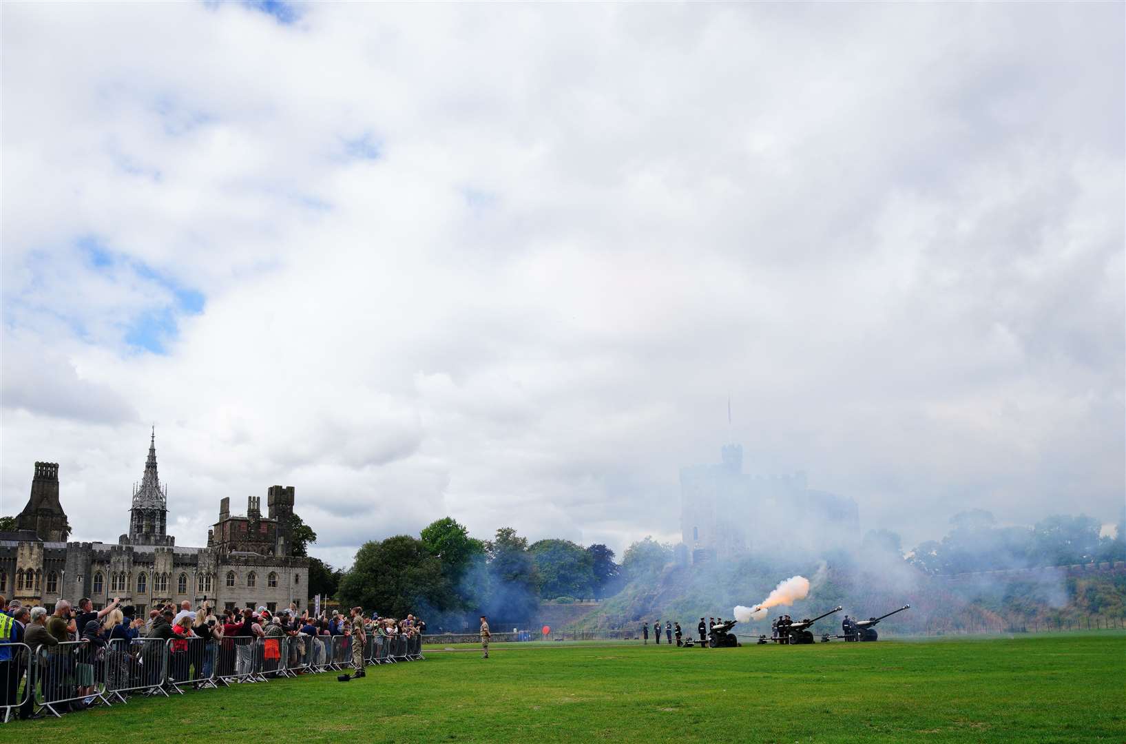 Crowds watched at the salute was fired in Cardiff (Ben Birchall/PA)