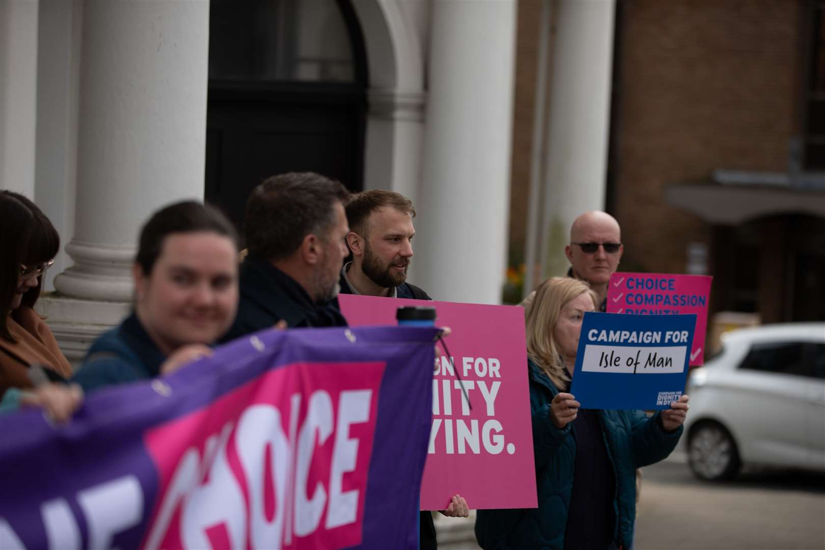 Supporters of the Assisted Dying Bill gathering outside Tynwald, the Isle of Man’s parliament (Lee Notman/PA)