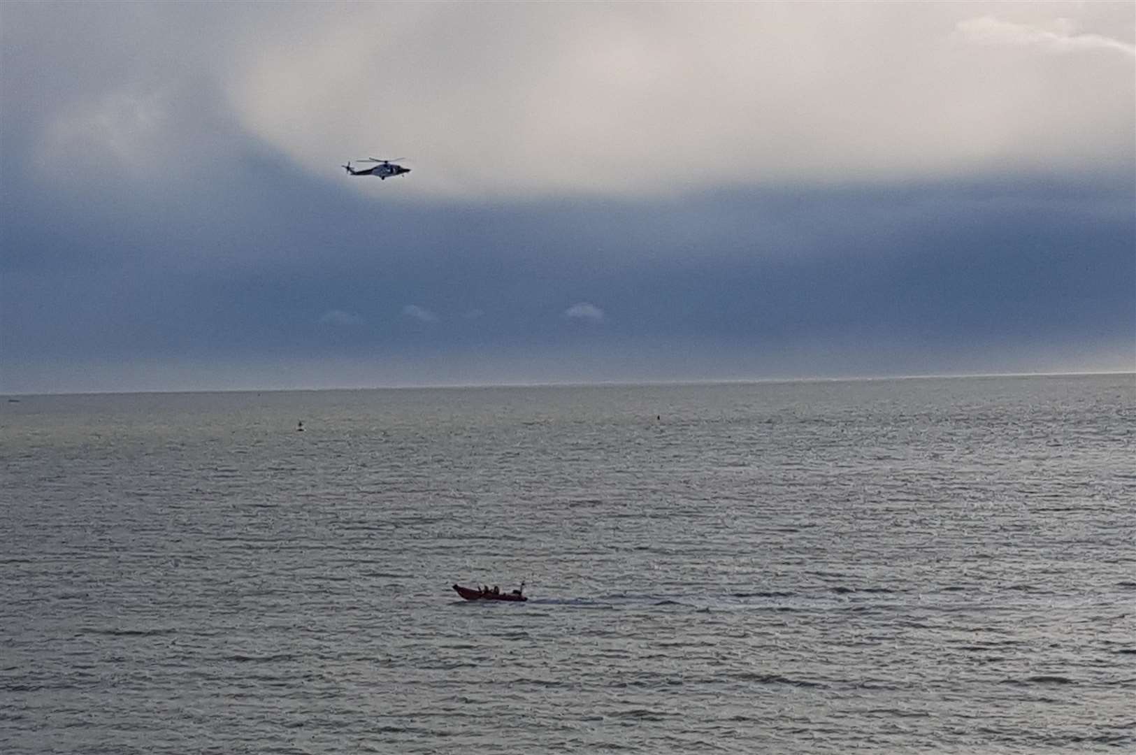 Coastgaurd helicopter flying low near the harbour (6117693)