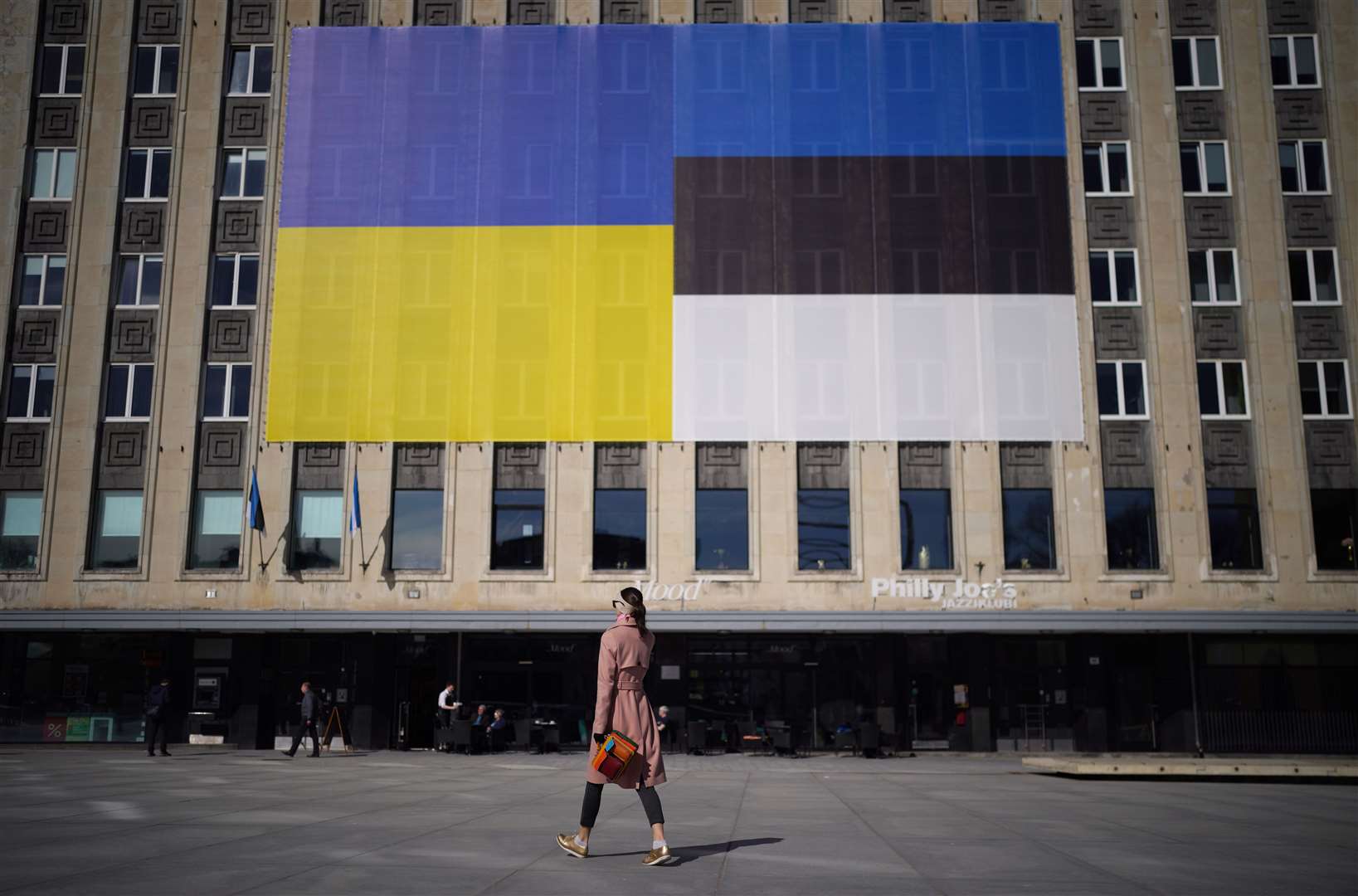 The Ukrainian flag next to the Estonian Flag on a building in Freedom Square, Tallinn (Ben Birchall/PA)